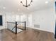 Upstairs landing featuring dark hardwood floors and railing at 8106 Mabury Ln, Orlando, FL 32832