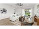 Bright living room with sliding glass doors, neutral decor, wood-look tile flooring, and modern furnishings at 8106 Mabury Ln, Orlando, FL 32832