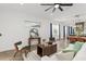 Spacious living room showcasing contemporary decor, tile flooring, and seamless flow to kitchen and dining area at 8106 Mabury Ln, Orlando, FL 32832