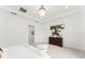 Airy main bedroom featuring tray ceilings, large windows, plush carpet and a stylish ceiling fan at 8106 Mabury Ln, Orlando, FL 32832
