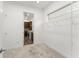 Carpeted walk-in closet space featuring wire shelving and bright natural light at 8106 Mabury Ln, Orlando, FL 32832