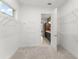 Walk-in closet with wire shelving leading to the en-suite bathroom at 8106 Mabury Ln, Orlando, FL 32832