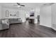 Spacious living room with modern flooring, neutral walls, and an open layout leading to the kitchen at 917 Dekleva Dr, Apopka, FL 32712