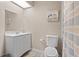 Bright bathroom with white vanity, decorative painting and neutral color palette at 938 Southridge Trl, Altamonte Springs, FL 32714