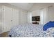 Bedroom features white curtains, a TV, and two closets at 938 Southridge Trl, Altamonte Springs, FL 32714