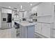 Contemporary kitchen featuring white cabinets, stainless steel appliances, and a center island at 938 Southridge Trl, Altamonte Springs, FL 32714