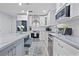 Modern kitchen with white cabinets, stainless steel appliances, and a center island with seating at 938 Southridge Trl, Altamonte Springs, FL 32714