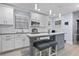 Stylish kitchen with white cabinets, island seating, and stainless steel appliances at 938 Southridge Trl, Altamonte Springs, FL 32714