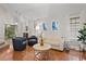Bright living room with hardwood floors, vaulted ceiling, and sliding doors to the patio at 938 Southridge Trl, Altamonte Springs, FL 32714