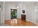 Bright room with hardwood floors, slider to patio, and a glimpse of the staircase at 938 Southridge Trl, Altamonte Springs, FL 32714