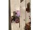 Hallway with open doorway view of a decorated sitting room with tiled floor at 1022 Love Ln # 35, Apopka, FL 32703