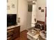 Living area featuring artwork on the walls, adjacent to an open doorway and view into the bathroom at 1022 Love Ln # 35, Apopka, FL 32703