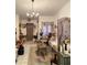 Cozy living room features decorative furnishings, a chandelier and tiled flooring at 1022 Love Ln # 35, Apopka, FL 32703