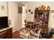 Living area featuring a bookshelf full of books, with an open doorway view into the bathroom at 1022 Love Ln # 35, Apopka, FL 32703