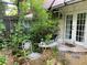 Cozy outdoor patio with bistro seating and lush greenery, perfect for relaxation at 1022 Love Ln # 35, Apopka, FL 32703