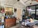 Inviting sunroom with rustic furniture and garden views, creating a serene indoor-outdoor space at 1022 Love Ln # 35, Apopka, FL 32703
