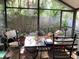 Inviting sunroom with tile table, perfect for enjoying the natural light and garden views at 1022 Love Ln # 35, Apopka, FL 32703