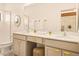 Spacious bathroom with double vanity, modern fixtures, and stylish stool at 10293 Ebb Tide Ln, Orlando, FL 32821