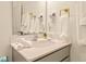 Bright bathroom featuring a gray vanity, elegant fixtures, and ample counter space at 10293 Ebb Tide Ln, Orlando, FL 32821
