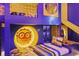 Playful bedroom boasts a minion themed bed and decor with a climbing net, adding a touch of fun and adventure at 10293 Ebb Tide Ln, Orlando, FL 32821