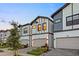 Inviting townhomes with modern design, two-car garages, and attractive landscaping create appealing neighborhood setting at 10293 Ebb Tide Ln, Orlando, FL 32821