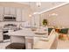Chic kitchen featuring stone countertops, modern appliances, and seamless transition to the adjacent dining area at 10293 Ebb Tide Ln, Orlando, FL 32821