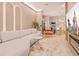 Comfortable living space features modern decor, a cozy sofa and a view to the fully equipped kitchen at 10293 Ebb Tide Ln, Orlando, FL 32821