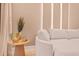 Cozy living room area showcases a stylish table decor, plush sofa and neutral color palette at 10293 Ebb Tide Ln, Orlando, FL 32821