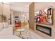 Open-concept living area with TV, modern decor and view of the kitchen with barstool seating at 10293 Ebb Tide Ln, Orlando, FL 32821