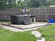 Backyard featuring a covered hot tub and patio area at 108 Country Club Cir, Sanford, FL 32771