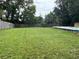 Spacious backyard with lush lawn, shed, and above-ground pool at 108 Country Club Cir, Sanford, FL 32771