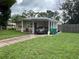 Single-story home with a covered carport and freshly cut lawn at 108 Country Club Cir, Sanford, FL 32771