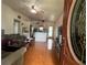 Inviting living room flowing into the kitchen with tiled floors, a ceiling fan, and lots of natural light at 108 Country Club Cir, Sanford, FL 32771