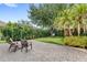 Enjoy this backyard with a brick patio and lush landscaping at 11425 Claymont Cir, Windermere, FL 34786