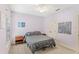 Comfortable bedroom with lilac walls, windows with bright view, and ceiling fan at 11425 Claymont Cir, Windermere, FL 34786