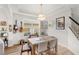 Cozy dining room with natural light, a wooden table, and decor at 11425 Claymont Cir, Windermere, FL 34786