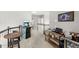 Spacious upstairs hallway with arcade game, kitchenette, and seating area at 11425 Claymont Cir, Windermere, FL 34786