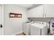 Bright laundry room with modern appliances and ample storage at 11425 Claymont Cir, Windermere, FL 34786