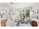 Comfortable living room with large windows, stylish decor, and cozy seating at 11425 Claymont Cir, Windermere, FL 34786