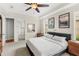 Serene main bedroom with a comfortable bed, neutral decor, and a view of the ensuite bathroom at 11425 Claymont Cir, Windermere, FL 34786