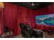 Enjoy movies in this media room with a recliner and large screen at 11425 Claymont Cir, Windermere, FL 34786