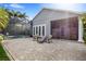 Relax on this brick patio with view of the pool and landscaped yard at 11425 Claymont Cir, Windermere, FL 34786