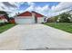 Charming single-Gathering home with a well-maintained lawn and a two-car garage at 11500 Benbow Ct, Orlando, FL 32837