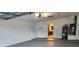 Spacious garage with painted walls, an exterior door, and access to the kitchen at 11500 Benbow Ct, Orlando, FL 32837