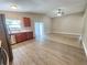 Well-lit kitchen featuring stainless steel appliances and wood cabinetry with ample counter space at 11500 Benbow Ct, Orlando, FL 32837