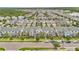 A beautiful aerial view of a residential neighborhood showcasing well-maintained townhomes and lush landscaping at 12015 Prologue Ave, Orlando, FL 32832
