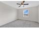 Empty bedroom featuring neutral walls, ceiling fan, a carpeted floor and a window at 12015 Prologue Ave, Orlando, FL 32832