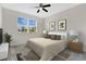 This bedroom offers natural light from the large window and a ceiling fan for added comfort at 12015 Prologue Ave, Orlando, FL 32832