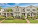 Charming townhome boasts a well-manicured lawn, lovely landscaping, and inviting facade at 12015 Prologue Ave, Orlando, FL 32832