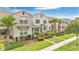 Desirable townhome featuring beautiful landscaping, well-maintained lawn, and inviting curb appeal at 12015 Prologue Ave, Orlando, FL 32832